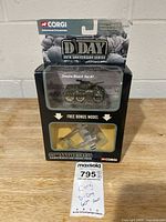 Front of sealed Corgi D-Day set showing armored vehicle and bonus plane