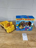 Educo Double Bubble maze box beside Pooh truck and lot tag