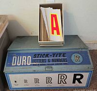 Closed Duro display case with box of large letters on top