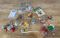 Group shot of all pins, erasers and pipe on table