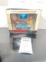 Box front showing handcar and characters, Lionel branding visible