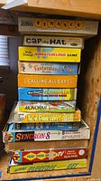 Full stack of board games showing all visible titles