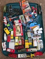 Tray containing entire assortment of die-cast vehicles, boxed and loose