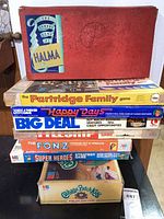 Stack of eight vintage board games