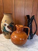 Group shot of all three vases and pitchers