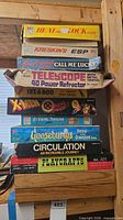 Full stack of ten boxed items showing titles