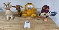 Group shot of all four vintage plush toys