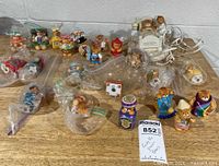 Overview of all bear figurines and nightlight lamp on tabletop