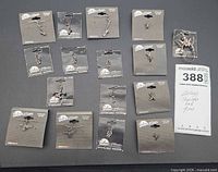 Group shot showing all sixteen Silver Moon sterling silver pieces on cards