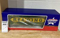 Boxed G scale Reading refrigerator car visible through window