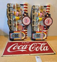 Full lot showing two 3-D diner clocks and metal sign