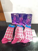 Front view of packaged Peeps socks and shoe accessories