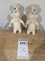 Full view of both 1971 Pillsbury Doughboy figures standing upright