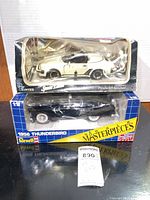 Front view of both boxed diecast cars