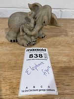 Front view of mother and baby elephant figurine with lot card