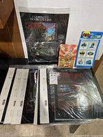 All items grouped: multiple Star Wars bookcovers, Road Runner car, Batman favors
