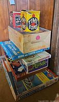 Stack of six vintage game and toy kit boxes