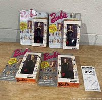 All four packaged Barbie keychains front view