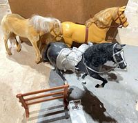 All three model horses with jump rail visible