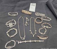All jewellery pieces arranged on black background
