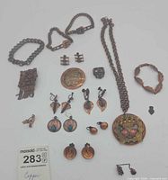 Full lot overview showing all copper jewelry pieces