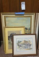 Group shot showing three framed artworks leaning together