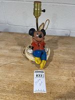 Front view of Mickey Mouse figural lamp without shade