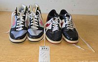 Front view of both sneaker pairs side by side