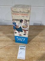 Front view of Norman Rockwell Character Doll "Suzy" boxed packaging