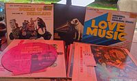 Front view showing several record covers including Dukes of Dixieland, I Love Music, stereo test disc and others