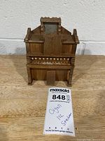 Front view of Stackman miniature pump organ showing design details