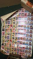 Full view of uncut trading-card sheet showing multiple rows of cards and stickers