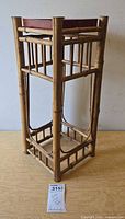 Full view of rattan side table showing frame and tray