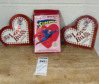 Front view showing Superman card box flanked by two Love Bugs books