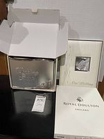 Both books and Royal Doulton box visible