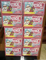 Ten boxed playsets stacked