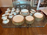 Full set of Mikasa Royal Glimmer dishes displayed on glass table