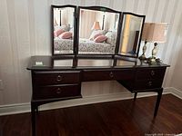 Full front view showing table and attached tri-fold mirror