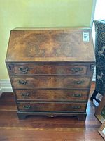 Front view of the secretary desk, closed top, all four drawers visible
