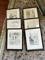 Overview of six framed black and white wall art prints laid out on floor, some signed, one frame damaged