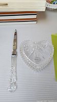 Image showing Wedgwood heart-shaped crystal trinket box and Waterford crystal letter opener side by side on a white surface.