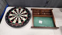 Photo showing both the Eastpoint Stonebridge dart board and the wooden score board side by side on a table.
