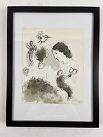 Front view of framed lithograph against wall