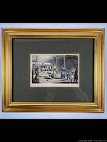 Handcoloured engraving by Robert Cruikshank in gold decorative frame with dark matte. Shows detailed scene of people in Fleet Prison London, includes minor chip in lower right frame corner visible.