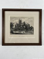 Front view of framed engraving showing Wells Cathedral and matting within a dark wooden frame