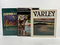 Front cover view of three books standing upright showing dust jackets with Canadian art themes and titles by Joan Murray, William Withrow, and Peter Varley.
