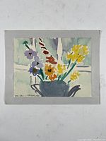 Full view of floral watercolor painting mounted on gray mat board.