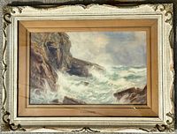 Full view of framed seascape showing ornate cream frame, gilt liner and mounted painting
