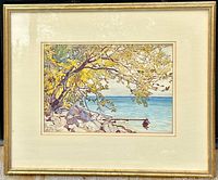 Framed watercolour painting showing a lakeside scene with a tree, rocks, and dock. The frame is gold-toned with off-white mats.