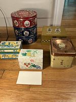 Overview of all boxes included, showing variety in shape, size, and decorative patterns